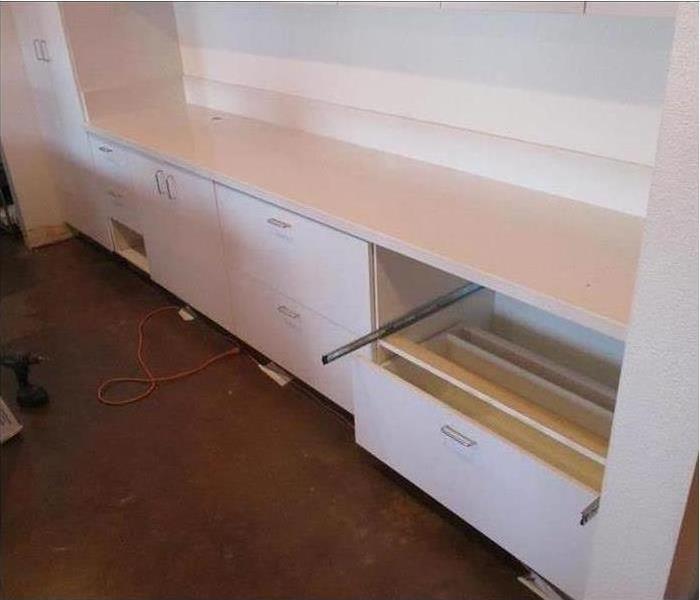Fixed white cabinets 